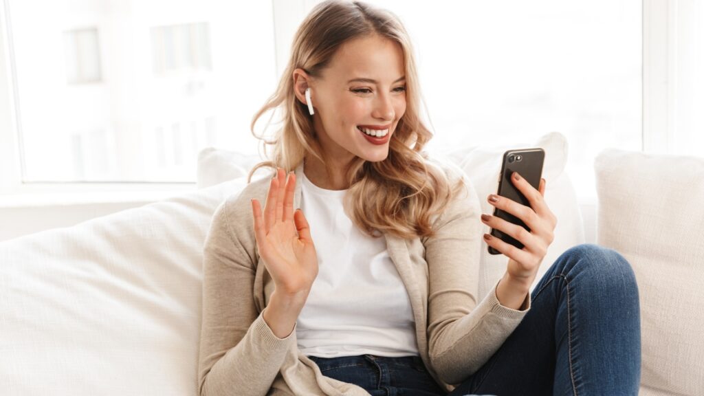 lady waving goodbye during a video call