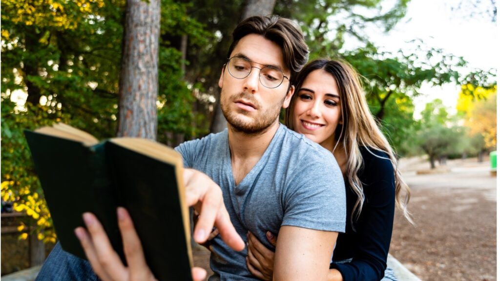 couple on a book date in a secluded garden