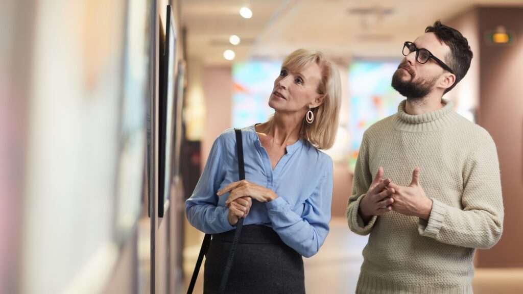 couple exploring objects in a museum together
