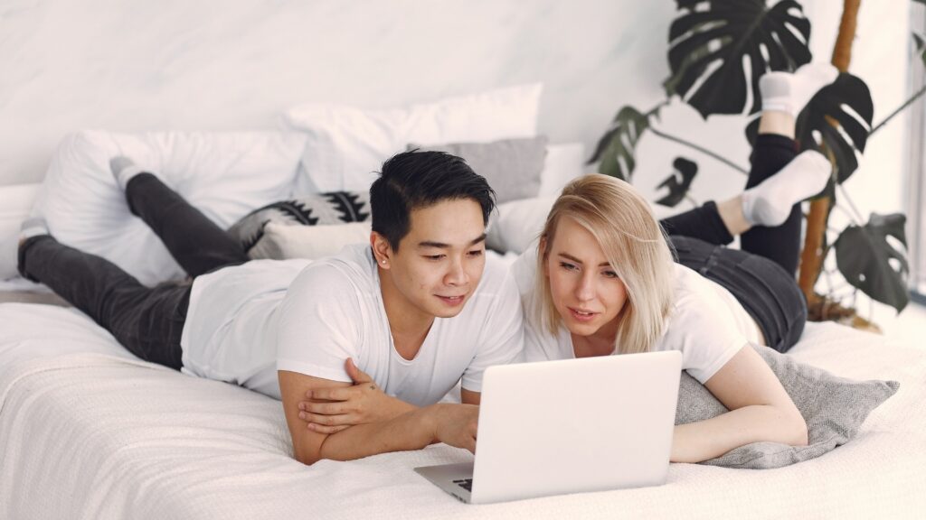 man and woman watching netflix 