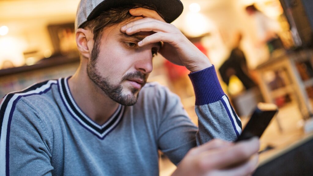 man being anxious about his partner's delayed response
