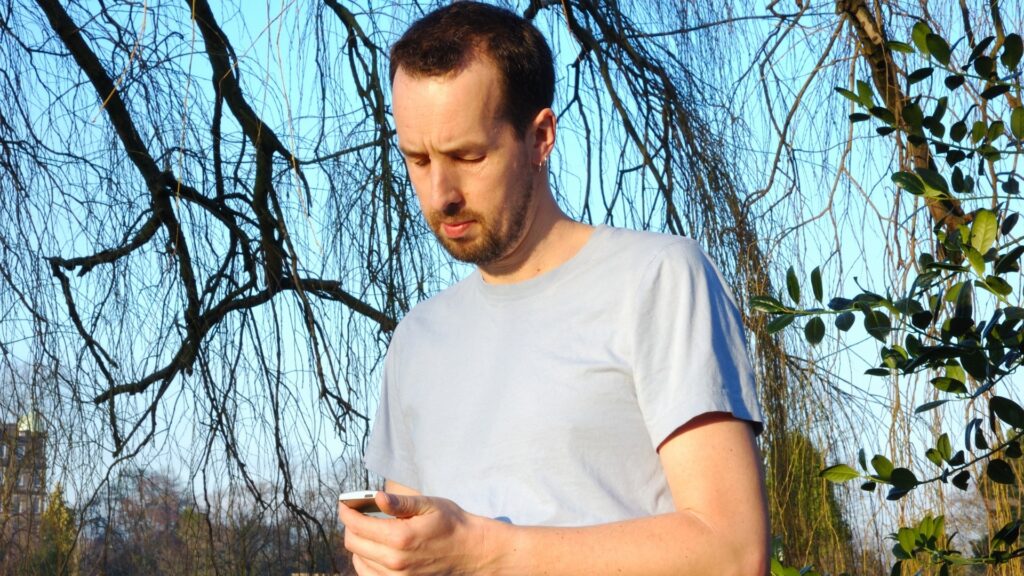 man unhappy because his long-distance partner rarely asks about his everyday life except their usual robotic check-ins
