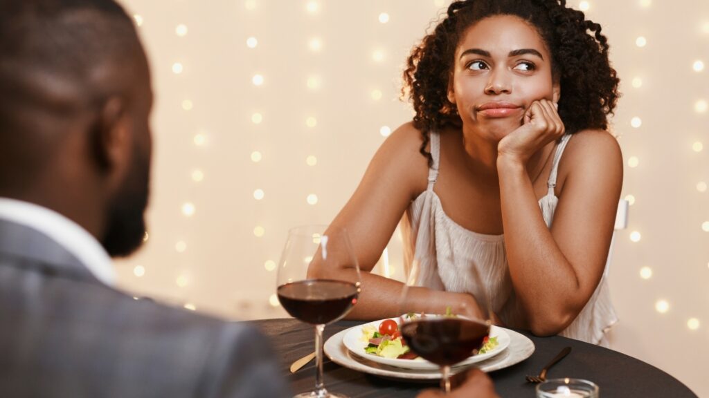 lady getting bored during her dinner date