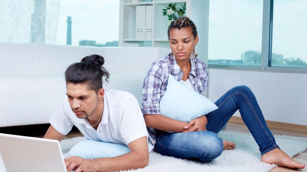 lady in a checked shirt uncomfortable with her boy friend's chats