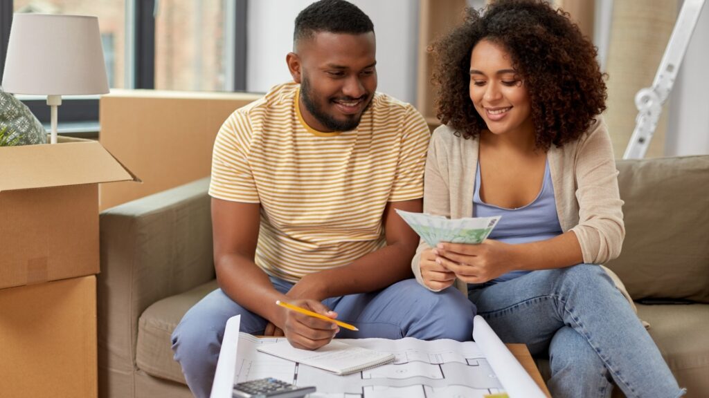 long distance couple sitting to run their monthly financial analysis