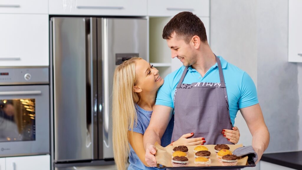 young couple baking a cake