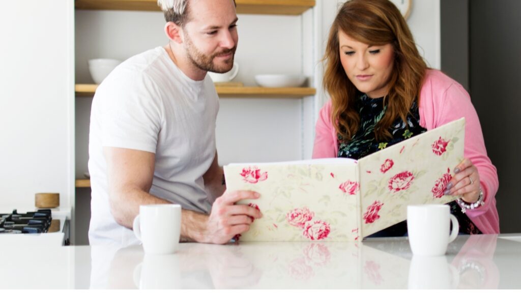 lady going through the photo album of her partner's family