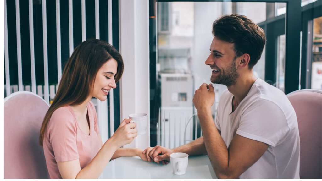 lady feeling nervous as she sits across her long distance partner in a restaurant for the first time