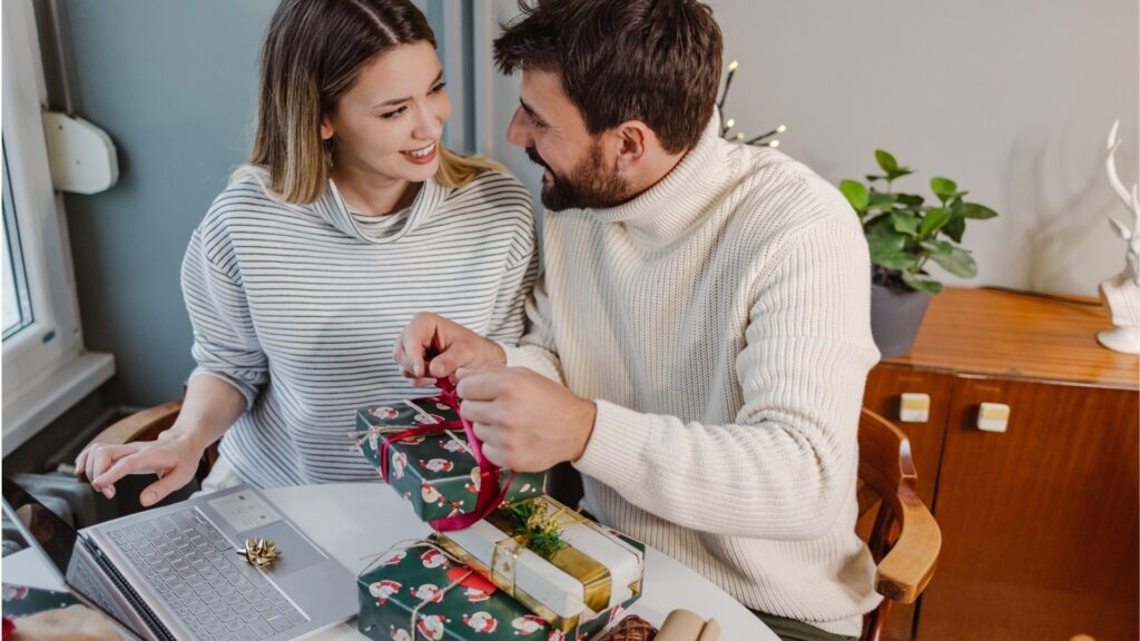 man opening a gift for his woman