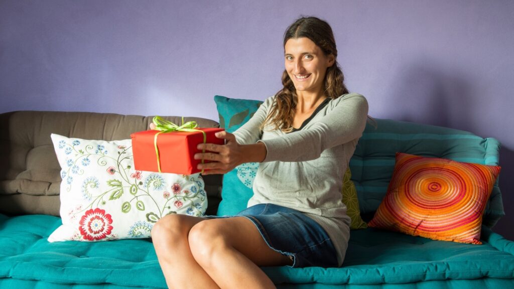 woman really excited about receiving a care package from her long distance partner