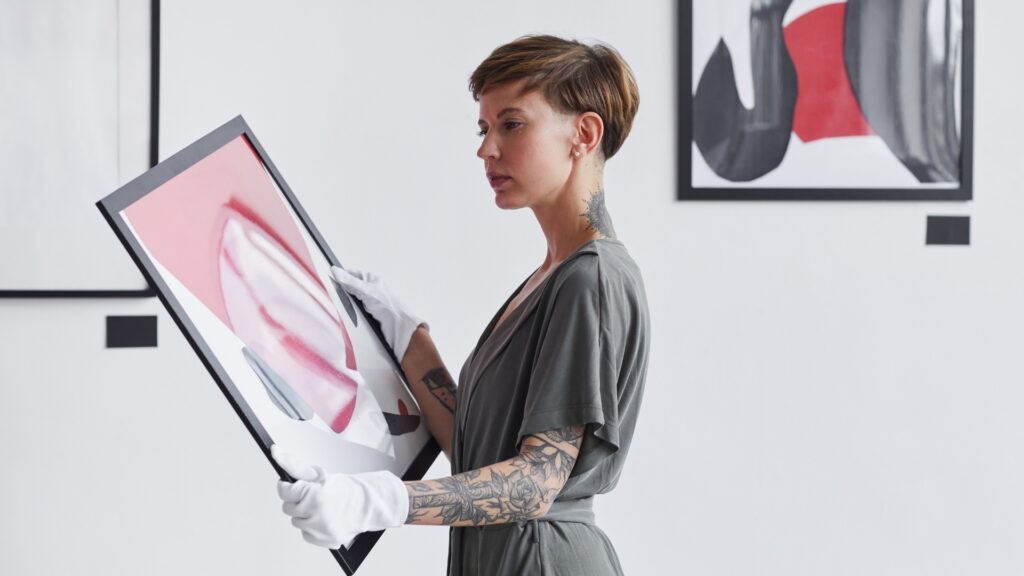 young lady starring at an illustration gifted her by her long distance partner