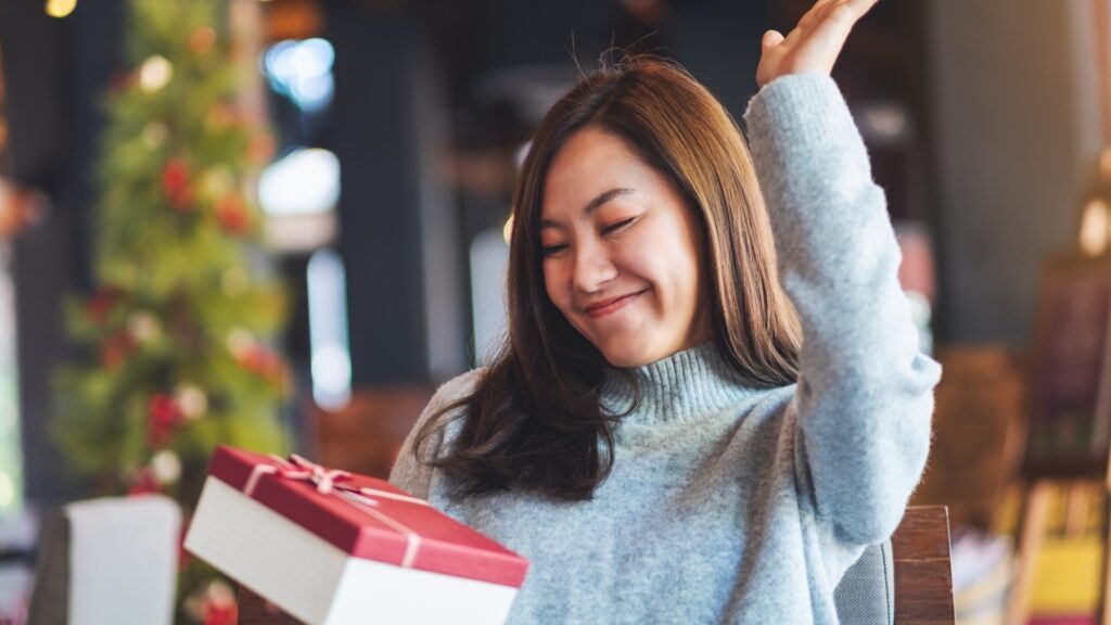 happy American woman receiving a care package