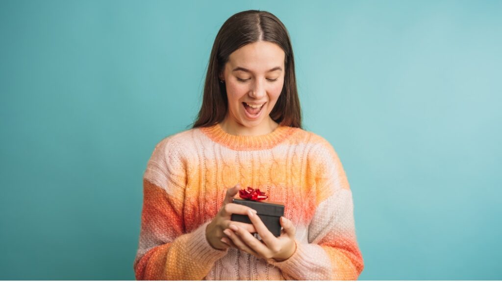 lady holding a box of snacks