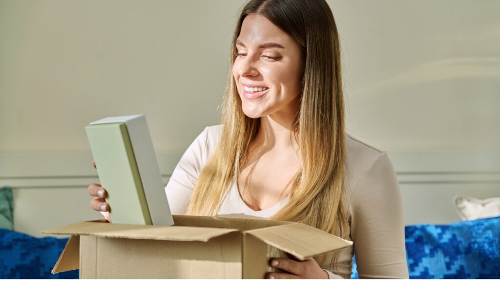 young Asian woman unboxing her fragrance box