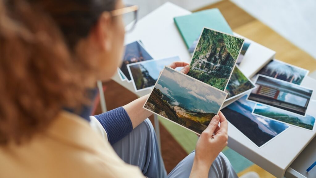 lady holding a photo collage