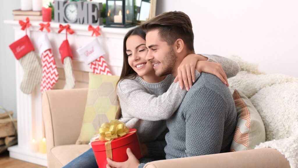 woman receiving a gift from man