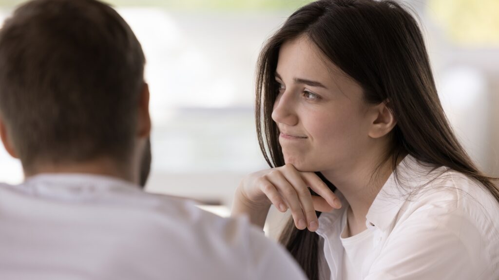 nervous woman talking to man