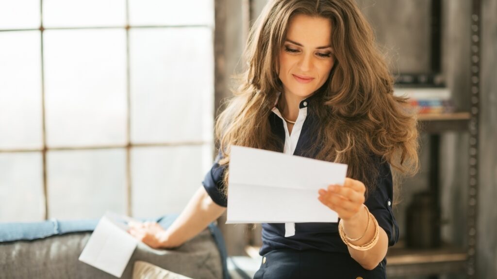 lady reading a letter from her long distance partner