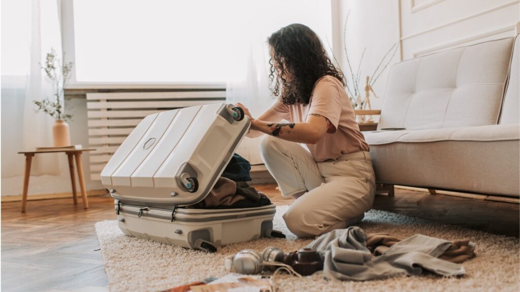 young lady packing for a travel