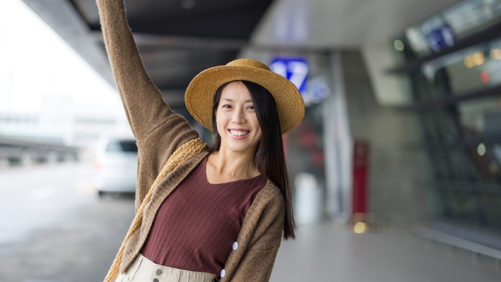 lady waving goodbye to her city