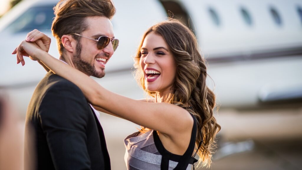 happy lady hugging her man at the airport