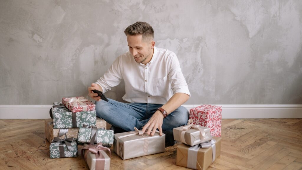 man sitting with his surprise boxes ingenuine admiration 