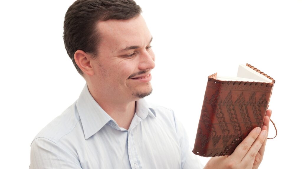 man reading his relationship memory group sent to him by his long distance girl friend 