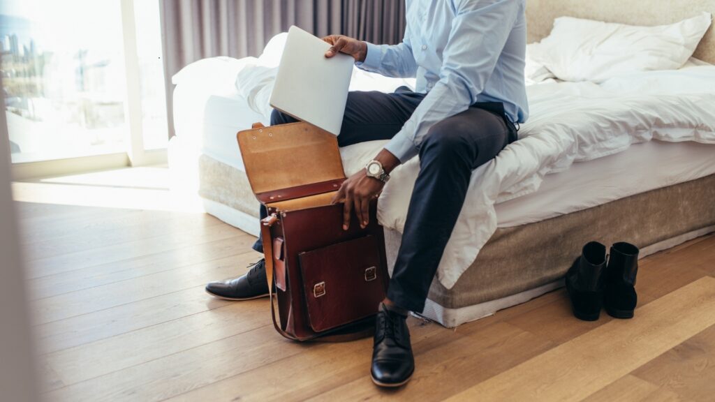 man packing his bags to go visit his long distance partner