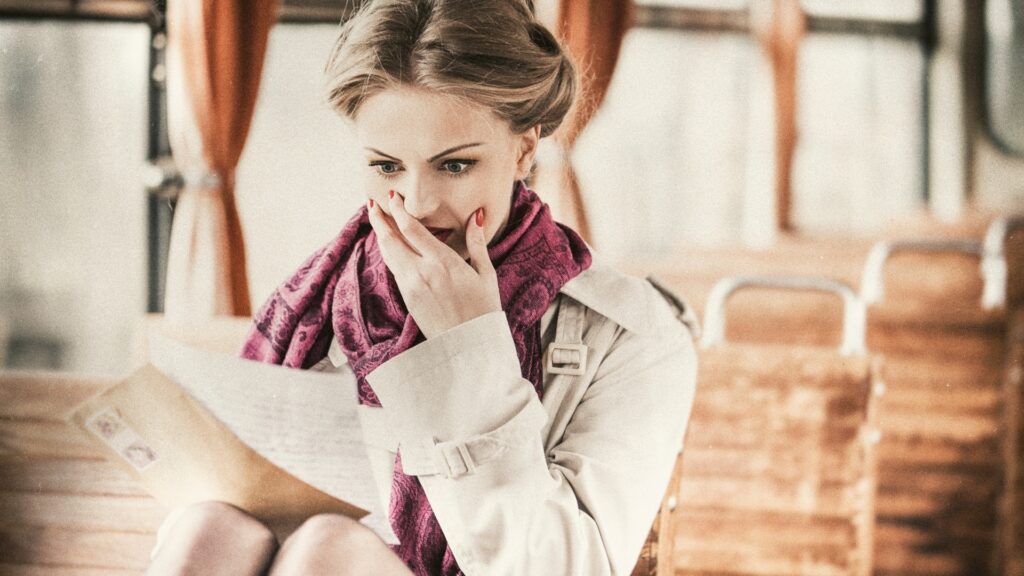 lady in shock as she reads a letter