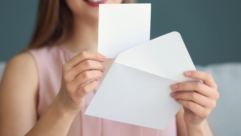 Lonely young woman opening letter