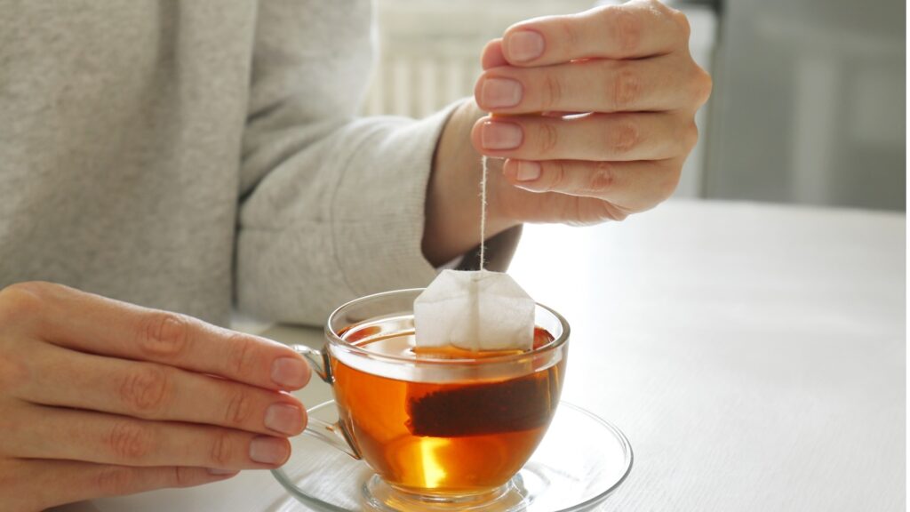 woman mixing her evening tea
