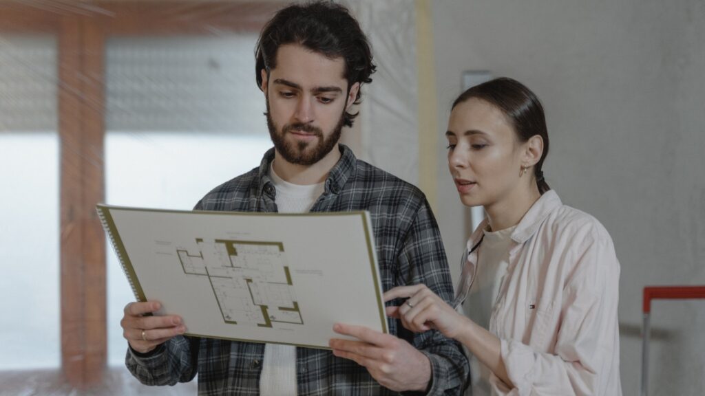 woman trying to understand what her partner is explaining to her on paper
