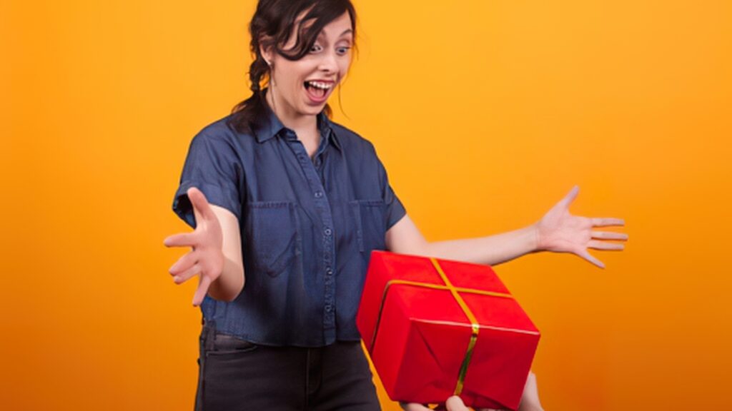 excited lady receiving a suprise box