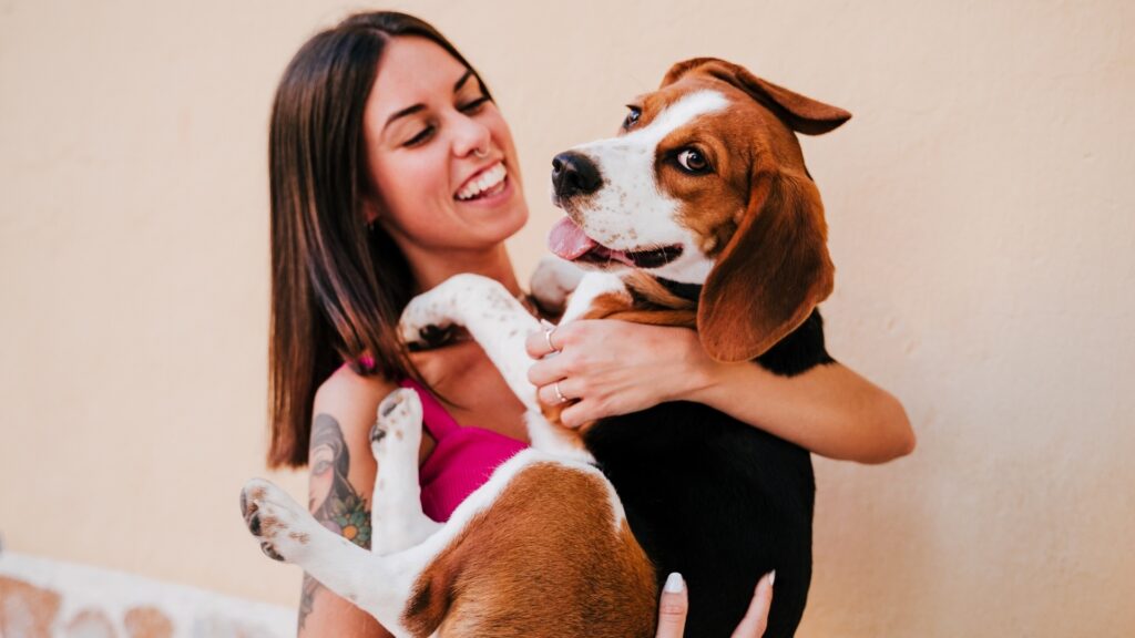 happy lady carrying her pet along